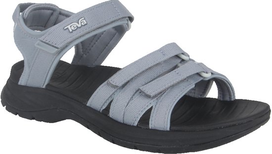 Grijze Teva sandalen met zwarte zool en verstelbare bandjes.