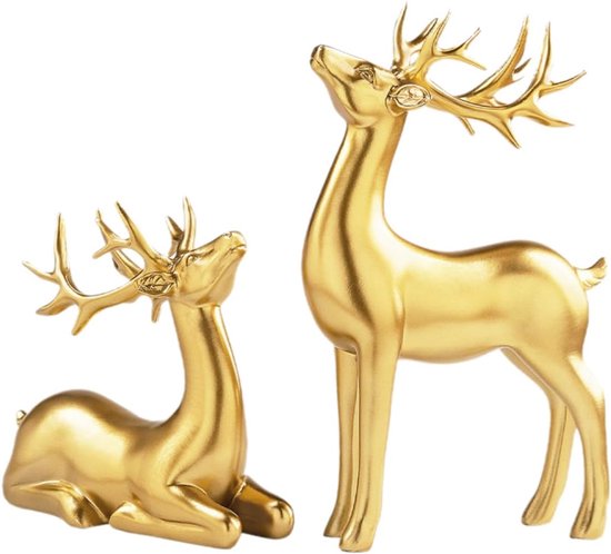 Twee gouden hertenbeeldjes, één zittend en één staand, op een witte achtergrond.