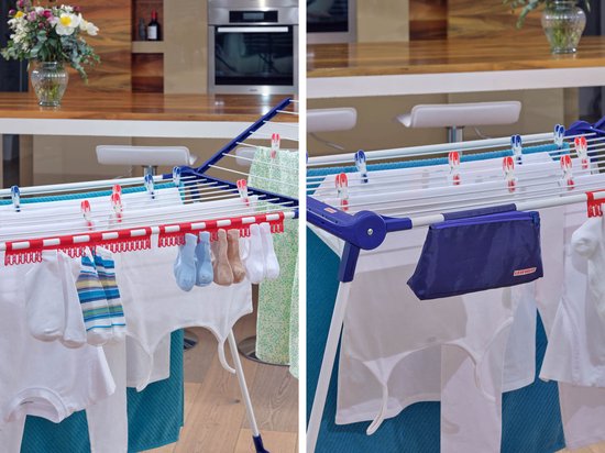 Gros plan d'un étendoir blanc Leifheit Pegasus 180 avec du linge blanc, des chaussettes et une robe verte.