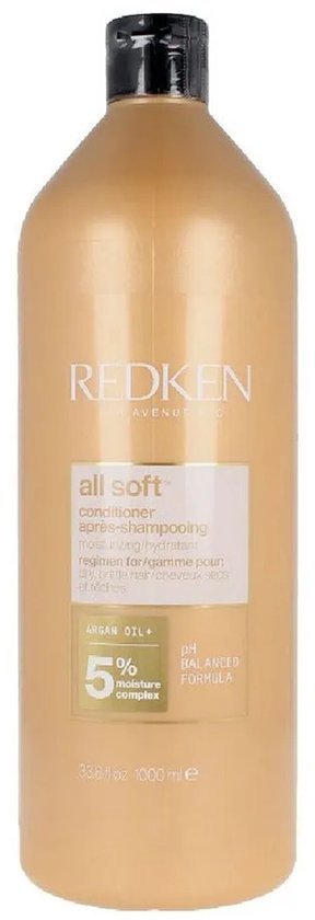 Bouteille dorée de revitalisant Redken avec étiquette blanche. Contient 'Argan Oil + 5% moisture complex'.