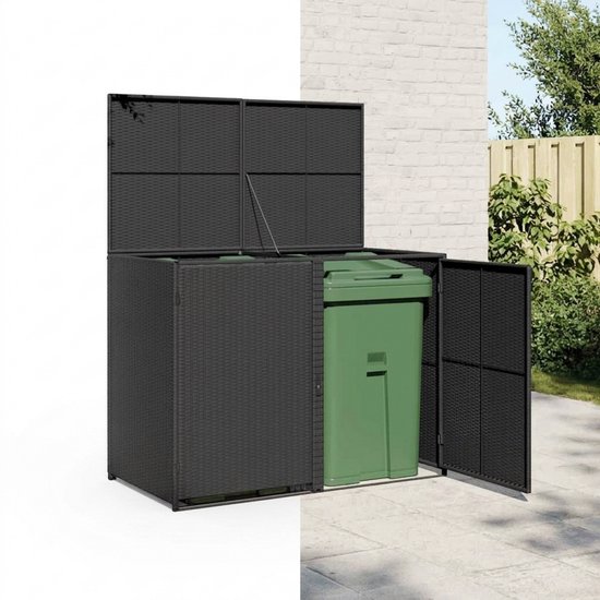 Zwarte kliko ombouw met groene afvalbak, buiten bij een bakstenen muur.