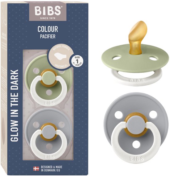 BIBS verpakking met twee spenen, 'Glow in the Dark'. Een groene speen en een grijze speen, beide met gouden en witte ringen. Verpakking toont 'Anatomical Natural Rubber Latex'.