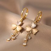Sjika - Vlinder Oorbellen Dames Goudkleurig – Hartvormige Kristal Oorringen – Elegante Hangoorbellen met Strass – Trendy Sieraden voor Dames - Cadeau voor haar