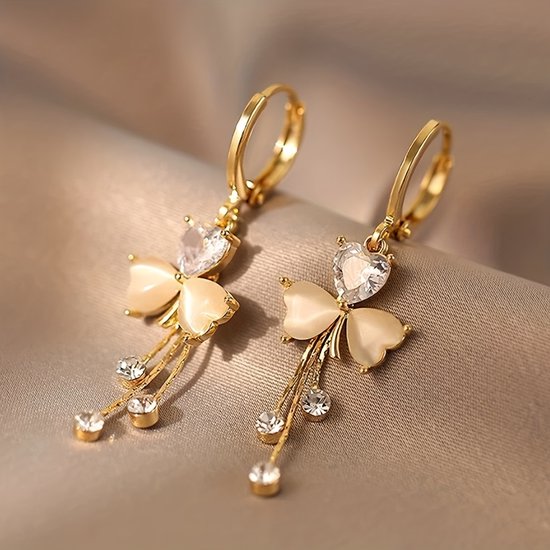 Sjika - Boucles d'oreilles papillon pour femme Dorées – Créoles en cristal en forme de cœur – Boucles d'oreilles pendantes élégantes avec strass – Bijoux tendance pour femme - Cadeau pour elle