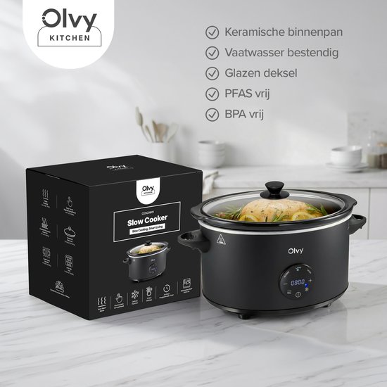 Zwarte Olvy slowcooker met glazen deksel naast een gesloten productdoos met icoontjes.