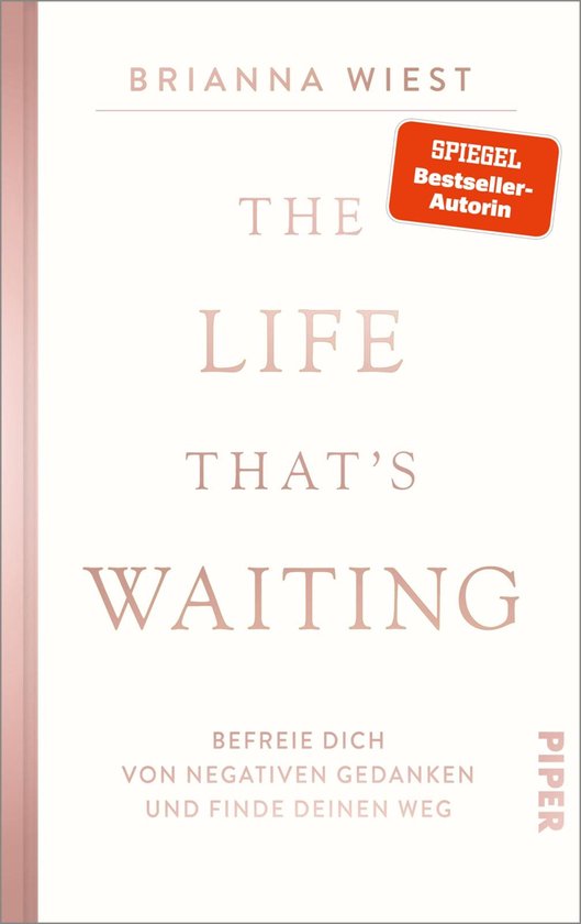 Boek kaft met de titel 'The Life That's Waiting' in roze letters. Ondertitel 'Befreie dich von negativen Gedanken und finde deinen Weg' en 'Spiegel Bestseller-Autorin'.