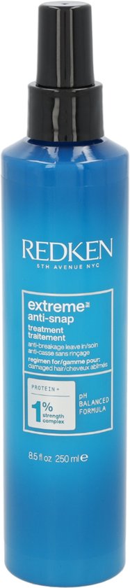 Blauwe fles Redken Extreme Anti-Snap leave-in treatment met zwarte spuitkop. "Extreme anti-snap treatment" en "anti-breakage leave in" op het etiket.