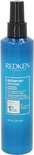 Blauwe fles Redken Extreme Anti-Snap leave-in treatment met zwarte spuitkop. "Extreme anti-snap treatment" en "anti-breakage leave in" op het etiket.
