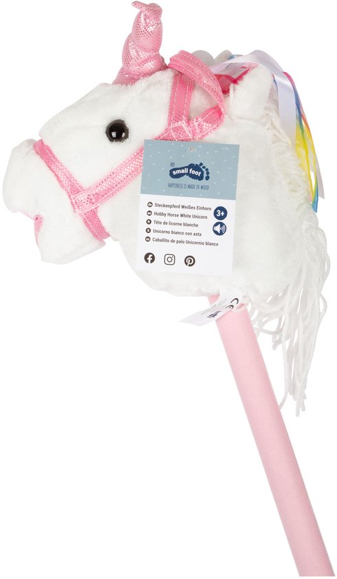 Wit eenhoorn speelgoedpaard op roze stok met label, glinsterende hoorn en roze hoofdstel.