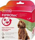 Doos Beaphar FIPROTec. Bruine krulhond kijkt naar rechts. Tekst: Tegen vlooien en teken. Beschermt 5 weken tegen vlooien. 4x 268 mg oplossing.