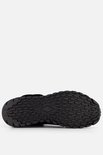 Onderaanzicht van de zwarte Skechers Uno Rugged laars met robuuste profielzool.