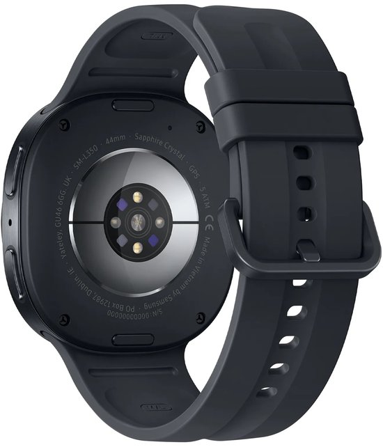 Achterkant van de zwarte smartwatch met hartslagsensoren en technische details op de behuizing.