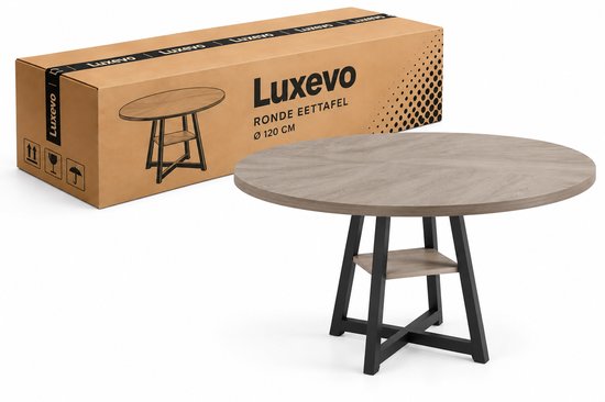 Ronde eettafel met grijs houten blad (Ø 120 cm) en zwart metalen frame met opbergvak, naast een Luxevo verpakking.