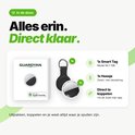 Inhoud van de doos: een Guardyan tracker en een zwarte sleutelhanger met ring.