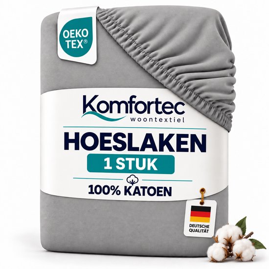 Drap-housse en coton gris Komfortec, avec étiquette OEKO-TEX, bord élastique et mention 100% coton.