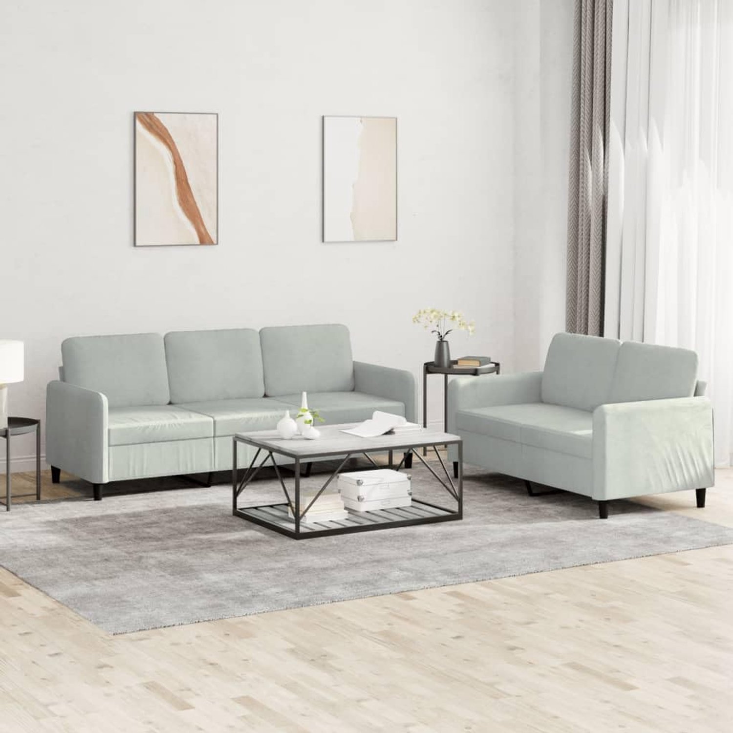 2-delige bankstel lichtgrijs fluweel met robuust frame en comfortabele bekleding voor een aangename zitervaring in de woonkamer