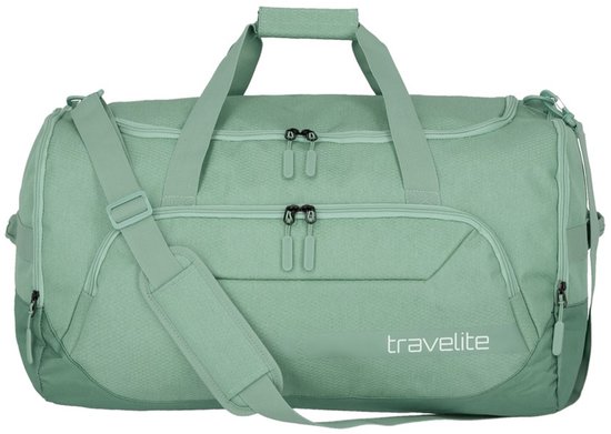 Sagegroene Travelite reistas met handvatten en schouderband. Het
bagagelabel 'travelite' is zichtbaar op de voorkant.