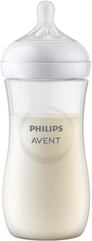 Biberon Philips Avent avec lait, transparent avec capuchon et tétine blancs.