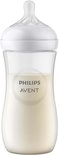 Biberon Philips Avent avec lait, transparent avec capuchon et tétine blancs.