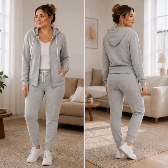 Een lichtgrijze joggingbroek met trekkoord en bijpassende hoodie met capuchon en ritssluiting.