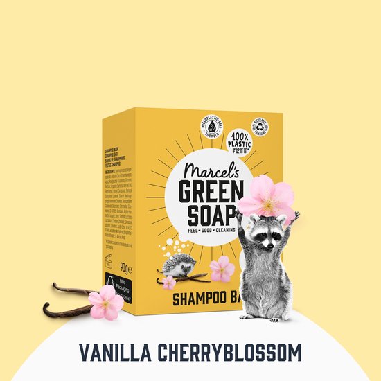 Gele verpakking met Marcel's Green Soap logo, egel en kersenbloesems. Een wasbeer met bloemen houdt een bloem vast.
