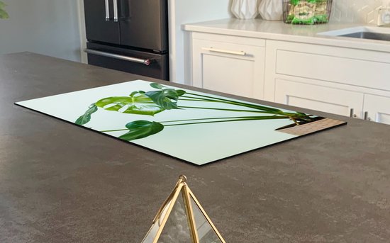 KitchenYeah® Inductie beschermer 30x52 cm - Monstera in een pot met een lichte achtergrond - Kookplaataccessoires - Afdekplaat voor kookplaat - Inductiebeschermer - Inductiemat - Inductieplaat mat