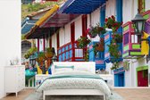 Behang - Fotobehang Kleurrijke balkons in Colombia - Breedte 600 cm x hoogte 400 cm