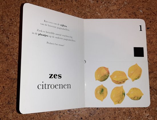 Mijn eerste boek over cijfers: tekst over cijfers en zes citroenen op een witte pagina, met cijfer 1.