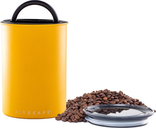 Matgele Airscape voorraadpot met handvat, naast een hoop koffiebonen en de losse deksel.