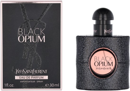 Zwart Yves Saint Laurent Black Opium Eau de Parfum fles met glitter en roze label, naast de bijpassende verpakking.