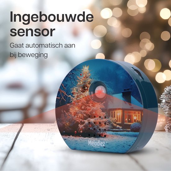 Kerstgeluiden huisje met kerstboom, sneeuwlandschap en sensor met rode laserstraal.