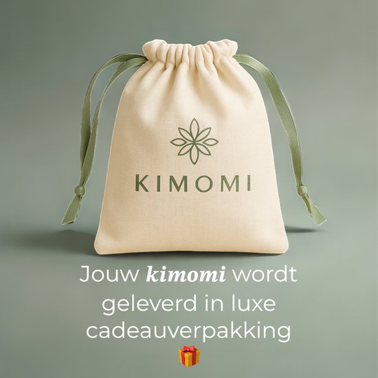 Beige geschenkverpakking met groene linten en het Kimomi logo, met tekst "Jouw kimomi wordt geleverd in luxe cadeauverpakking".