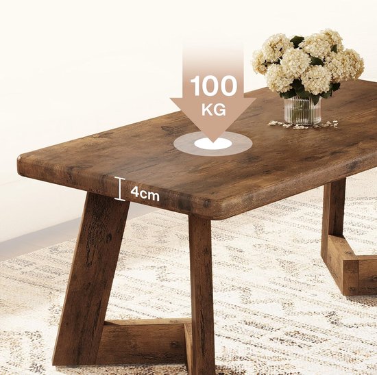 Houten salontafel met verweerd bruin oppervlak. De tafel heeft een dikte van 4 cm en een draagvermogen van 100 kg.