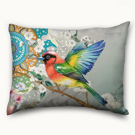 Een kussen met een levendige vogel op een tak, bloemen en mandala-patronen in blauw, groen, oranje en rood.
