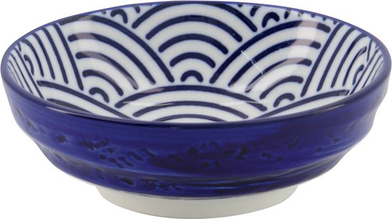 Wit schaaltje met blauwe golfdecoratie, effen blauwe buitenzijde.