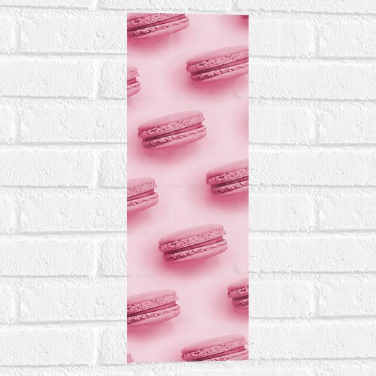 Muursticker - Patroon van Roze Macarons tegen Roze Achtergrond - 20x60 cm Foto op Muursticker