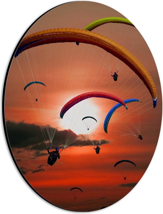 Dibond Ovaal - Grote Groep Paragliders tijdens Roodkleurige Zonsondergang - 21x28 cm Foto op Ovaal (Met Ophangsysteem)