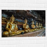 Muursticker - Rijen Gouden Boeddha's in Wat Tham Khuha Sawan Tempel in Thailand - 75x50 cm Foto op Muursticker