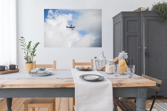 Poster Spitfire avec un ciel nuageux 120x80 cm - Tirage photo sur Poster (décoration murale salon / chambre)