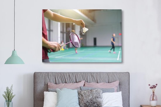 Canvas schilderij 150x100 cm - Wanddecoratie Een man staat op het punt om te badmintonnen - Muurdecoratie woonkamer - Slaapkamer decoratie - Kamer accessoires - Schilderijen op canvas