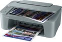 Grijze Canon Pixma printer print documenten met afbeeldingen van New York City, waaronder het Vrijheidsbeeld.