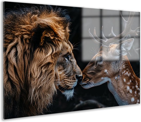 Gros plan d'un lion et d'un cerf tacheté avec des bois, leurs nez se touchant.
