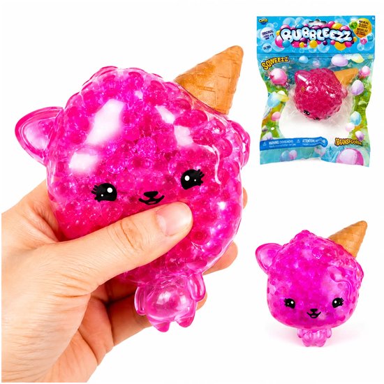 Roze, doorschijnend knijpbal in de vorm van een poesje met ijsje, met pareltjes erin. Verpakt en in hand.