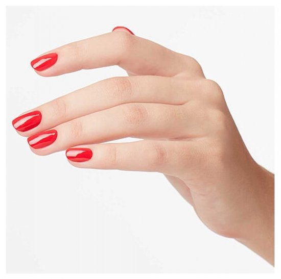 Hand met rode nagellak die elegant naar links wijst.