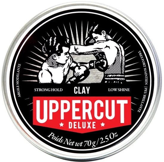 Blikje Uppercut Deluxe Clay met afbeelding van twee boksenden. Sterke fixatie, weinig glans.