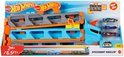 Hot Wheels Speedway Hauler speelset met blauwe cabine, grijze en oranje oplegger. Inclusief 3 speelgoedauto's.