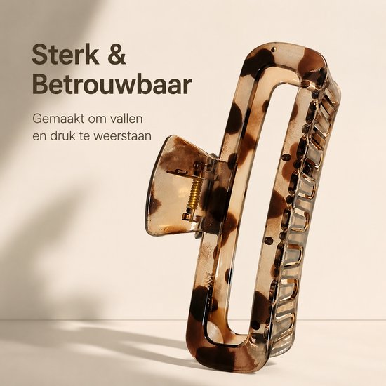 Transparante haarklem met luipaardprint en een gouden veer, sterk en betrouwbaar.