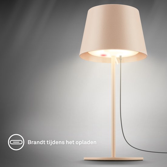 Lampe de table Nivo, beige, s'allume pendant la charge.