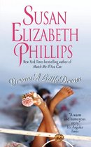 Boekcover van 'Dream A Little Dream' door Susan Elizabeth Phillips. Een vrouw ligt op een bed met een roze bloem in haar hand.