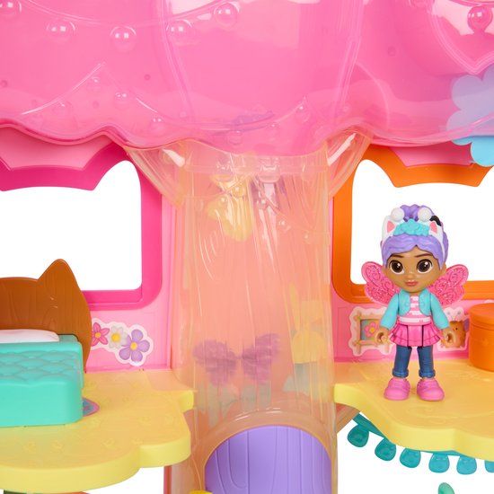 Roze Fairylandia speelhuis met Gabby pop met blauwe jas en roze rok.